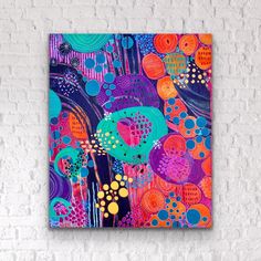 an abstract painting on a brick wall with colorful circles and dots in blue, orange, pink, green, purple