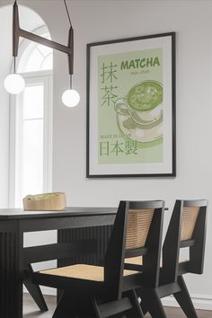 two chairs sitting at a table with a poster on the wall above them that says matcha