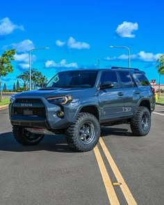 a gray toyota truck parked in a parking lot