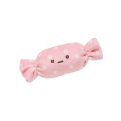 a pink stuffed animal with white polka dots on it's head and eyes, in the shape of a fish