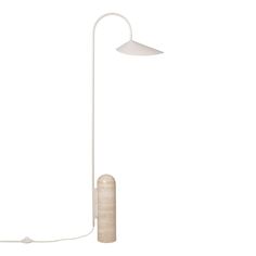 a white floor lamp with a wooden base and a light bulb on the end, in front of a white background