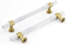 two white marble handles with gold hardware