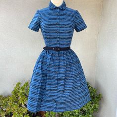 Retro Rockabilly Shirt Dress Blue Black Geometric Print Sz Small. Shipped With Usps Priority Mail Padded Flat Rate Envelope. Retro Rockabilly Style Shirt Dress Black Blue Geometric Print S. Made By Sugardale Nwt Crisp Cotton Blend Fabric And Lining ( No Fabric Tag) Peter Pan Collar And Belt. Side Pockets And Fitted Bodice. Note Some Photos Are Dress With Petticoat, No Petticoat Included. Belt Fits 29-31”X1” Shoulders 14” Sleeves 8” Bust 36” Waist 28” Hips 60” Length 38” Bodice Length 18” Blue Retro Cotton Vintage Dress, Blue Retro Dress With Peter Pan Collar, 1950s Shirt Waist Dress, Blue 1950s Style Cotton Vintage Dress, Blue Lace Midi Dress, Strapless Sundress, Flare Shirt, Vintage Plaid Dress With Button Closure, Sleeveless Linen Dress