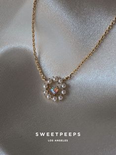 Product Details + Care - 18K Gold Dipped Over Brass - Brass: Copper + Zinc Alloy - 1 Necklace - Wipe Clean - Imported Dimensions - Chain is approximately 16" Have a question? Please message info@shopsweetpeeps.com and our support team will get back to you in 48 hours. Pearl Heart Necklace, Cross Gold, Pearl Heart, Dainty Gold Necklace, Silver Jewelry Pendant, Gold Dipped, Coin Necklace, Dainty Earrings, Support Team