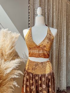 Choose bralette only, skirt only, or the two piece set~  BRALETTE DETAILS Gorgeous halter tie-back silk bralette in our stunning Desert Solstice© print! Perfect for a summer top, or fall layering.  S/M recommended for busts 30-34" L/XL recommended for busts 36-40" 2/3X recommended for busts 42-46"  SKIRT DETAILS Made from a beautiful lightweight silk blend fabric in our exclusive Desert Solstice© print. This airy, feminine skirt features multiple tiers for a flattering, flowy look + twirls that Bohemian Sleeveless Sets For Festival, Bohemian Sleeveless Festival Sets, Fitted Skirt Set For Beach Summer, Fitted Cropped Beach Skirt, Cropped Fitted Beach Skirt, Fitted Cropped Skirt For The Beach, Fitted Cropped Skirt For Vacation, Fitted Bohemian Sets For Summer, Hippie Triangle Halter Top For Festivals