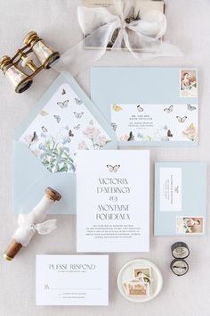 the wedding stationery is laid out and ready to be put into their guests'bags