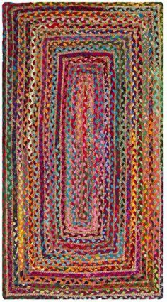 a multicolored rug with an oval design