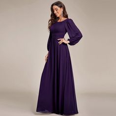 a woman in a long purple dress