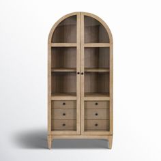 an arched wooden cabinet with drawers