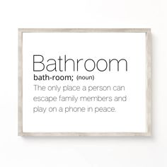 a bathroom definition sign hanging on the wall