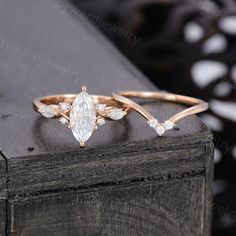 two rose gold rings with diamonds on top