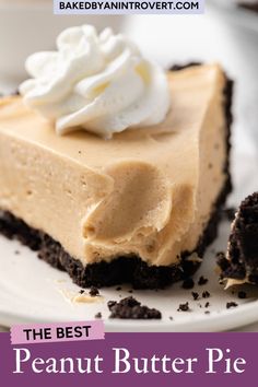 a piece of peanut butter pie on a plate with whipped cream and oreo crust