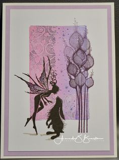 a card with an image of a fairy holding a flower in front of a pink and purple background