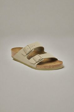 An icon of timeless design and legendary comfort the Arizona sandal has been defining style since 1973. The laid-back look comes in our signature Birkibuc® for a smooth finish. Complete with a contoured footbed that's ready to rack up as many miles and memories as you are. Contoured cork-latex footbed creates custom support with wear Birkibuc® synthetic upper Suede footbed lining helps keep you comfortable EVA sole is flexible & lightweight Two adjustable straps with metal pin buckles Made in Ge Khaki Birkenstock, Two Strap Sandals, Simple Sandals, Boys Sandals, Suede Fashion, Strap Wedge, Shoe Insoles, Girls Sandals, Eva Sole