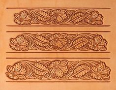 some type of carved wood panel with floral designs on the sides and flowers in the middle