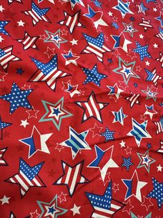 red, white and blue stars are scattered on a red background that is very similar to the american flag