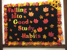 a bulletin board with fall leaves on it