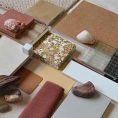 there are many different types of materials on the floor with rocks and stones around them