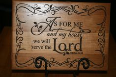 a wooden plaque with the words as for me and my house we will serve the lord