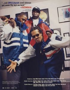 a magazine cover with three men in jackets and ties on the front, one wearing sunglasses