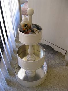 a three tiered cake stand on the floor