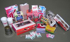 an assortment of food items are laid out on the counter top, including coffee mugs and packets