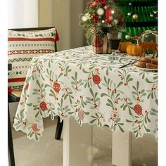 a table with a christmas tree in the background