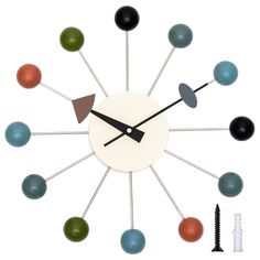 a clock with different colored balls on it