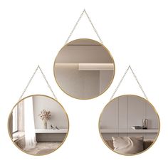 three circular mirrors hanging on the wall