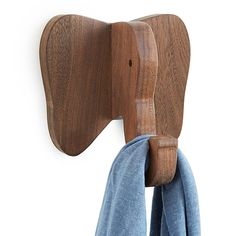 an elephant shaped coat rack with scarfs hanging from it