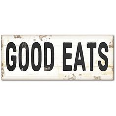 a sign that says good eats on it with the words'good eats'in black letters