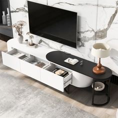 an entertainment center with a flat screen tv mounted on it's wall and drawers