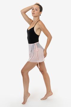 The Micro Mesh Ballet Wrap skirt is made of our lightweight, stretch nylon-spandex mesh and is finished with a delicate waist tie made from chiffon. This short skirt is intended for layering purposes and features a rounded wrap design that twirls with movement and a merrow hem. We recommend pairing this style with bodysuits and over unitards for a playful, dancewear-inspired look. Made in South Central, Los Angeles by workers earning fair wages. | Micro Mesh Ballet Wrap Skirt for Women in Black, Ballet Wrap Skirt, Los Angeles Apparel, Women In Black, South Central, Skirt For Women, Burgundy Color, Short Skirt, Wrap Skirt, Waist Tie