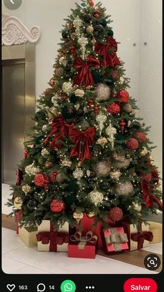 a decorated christmas tree with presents under it