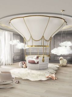 a child's room with a hot air balloon bed and rocking chair in it