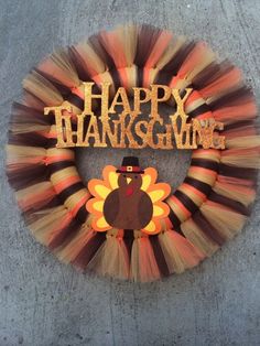 a happy thanksgiving wreath with a turkey on it