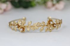 The beautifully intricate floral arm band has a rich variety of detailed leaves, flowers and pearls. The leaves and flowers are securely soldered onto an adjustable bracelet base, with pearls decorating the centre each flower. Each tip is decorated with a little flower sealing it, which makes it possible to wear the bracelet facing either way, front or back.  Size is approximately 10inch/25cm. This size could be slightly adjusted to become bigger or smaller. Please measure you arm before to make Bridal Jewerly, Gold Arm Band, Flowers And Pearls, Arm Bracelet, Hair Chains, Arm Bracelets, Dainty Bracelet, Gold Leaves, Arm Cuff