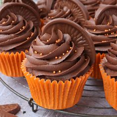 cupcakes with chocolate frosting on a white plate