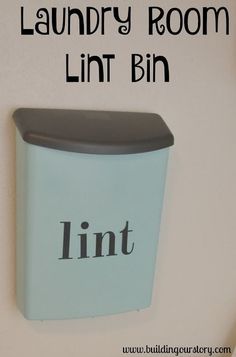 the laundry room bin is blue and has black lettering on it that says lint