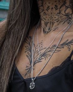 a woman with tattoos on her neck and chest