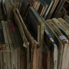 many books are stacked on top of each other