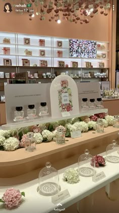 flowers and candles on display in a store