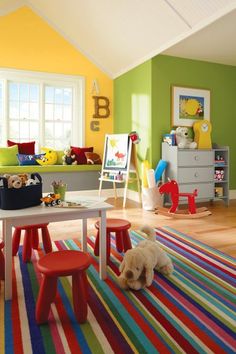 a child's playroom with colorful rugs and toys