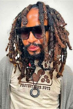 50 Dreadlocks For Men That Evoke Inspiration Hats For Men With Dreads, Black And Brown Dreads Men, Black Male Locs, Dreads With Crystals Men, Men Loc Extensions, High Top Dreads, Short Dread Styles