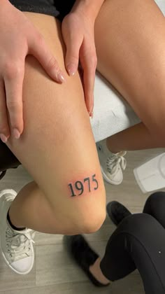 1975 tattoo above knee Year Knee Tattoo, 2005 Above Knee Tattoo, 2002 Above Knee Tattoo, Birth Year Tattoo On Leg, Year Above Knee Tattoo, Tattoo Ideas Knee Female, Number Knee Tattoo, Tattoo Ideas Female Knee, 2002 Knee Tattoo