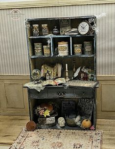 an old fashioned cabinet with many items on it