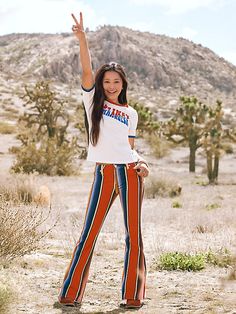 NEXT GENERATION FIERCE Lainey loves it when fans of all ages harness their energy to stand out in the crowd. The Girl's Wrangler® x Lainey Wilson Rodeo Ben Stripe Bell Bottoms are a matching version of the women’s jean. It pulls color cues from an archival piece created by the O.G. Western wear designer, Bernard “Rodeo Ben” Lichtenstein. The bold stripe pattern features 23 colors and takes its fit cues from the Wrangler Trumpet Flare Jean. Highlights also include the classic 'W' stitching on the Wilson Costume, Jean Bell Bottoms, Lainey Wilson, Short Uggs, Work Boots Men, Jumpsuit Jacket, Jean Shirt Dress, Bold Stripes, Pocket Bag