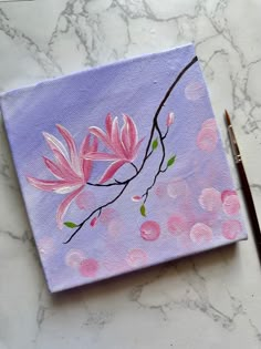 an acrylic painting of pink flowers on a purple background with a brown pencil