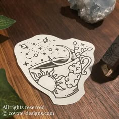 a wooden table topped with a cutting board next to a knife and some plants on top of it