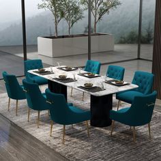 a dining room table with blue chairs around it